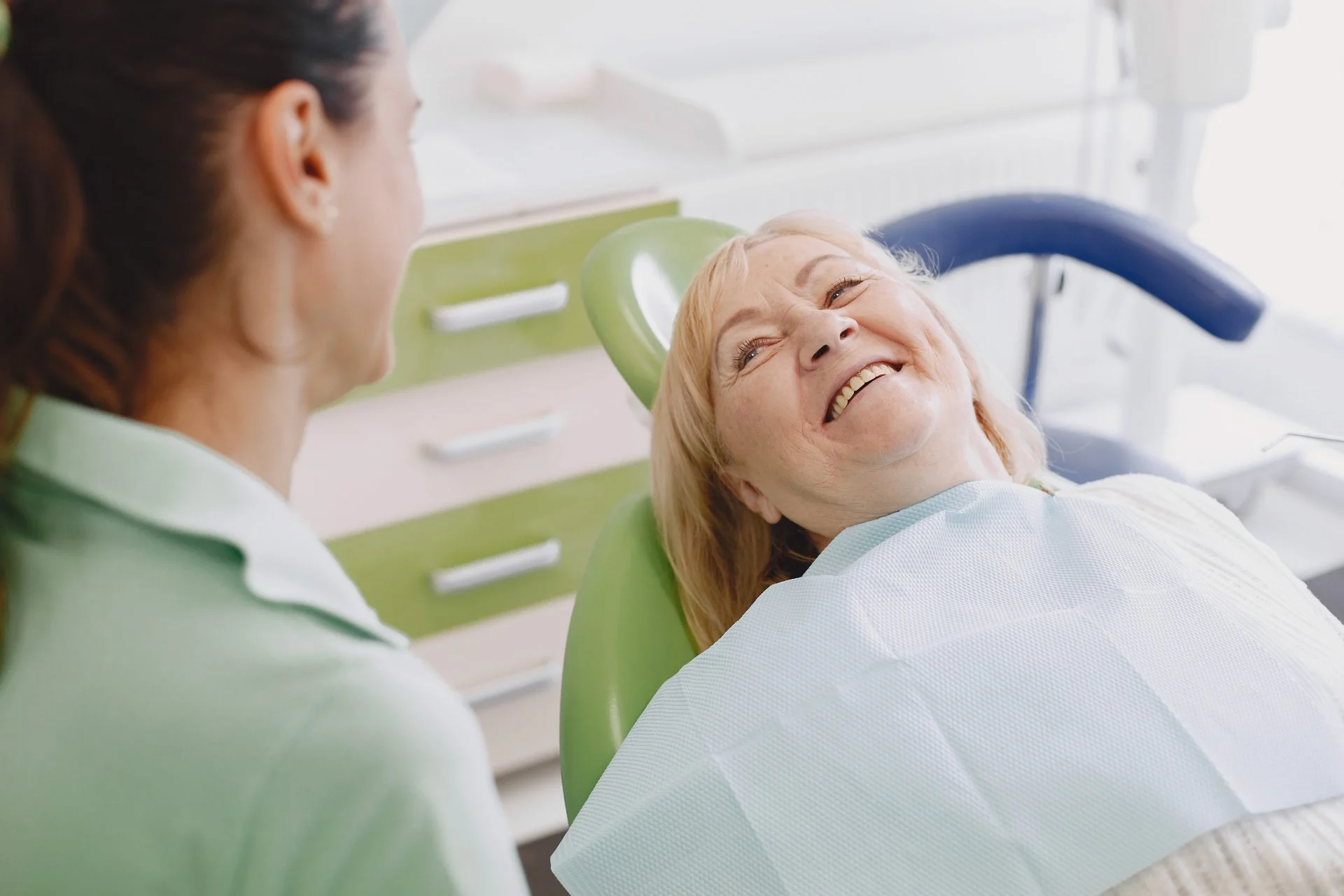 senior woman having dental treatment dentist s office woman is being treated teeth 1